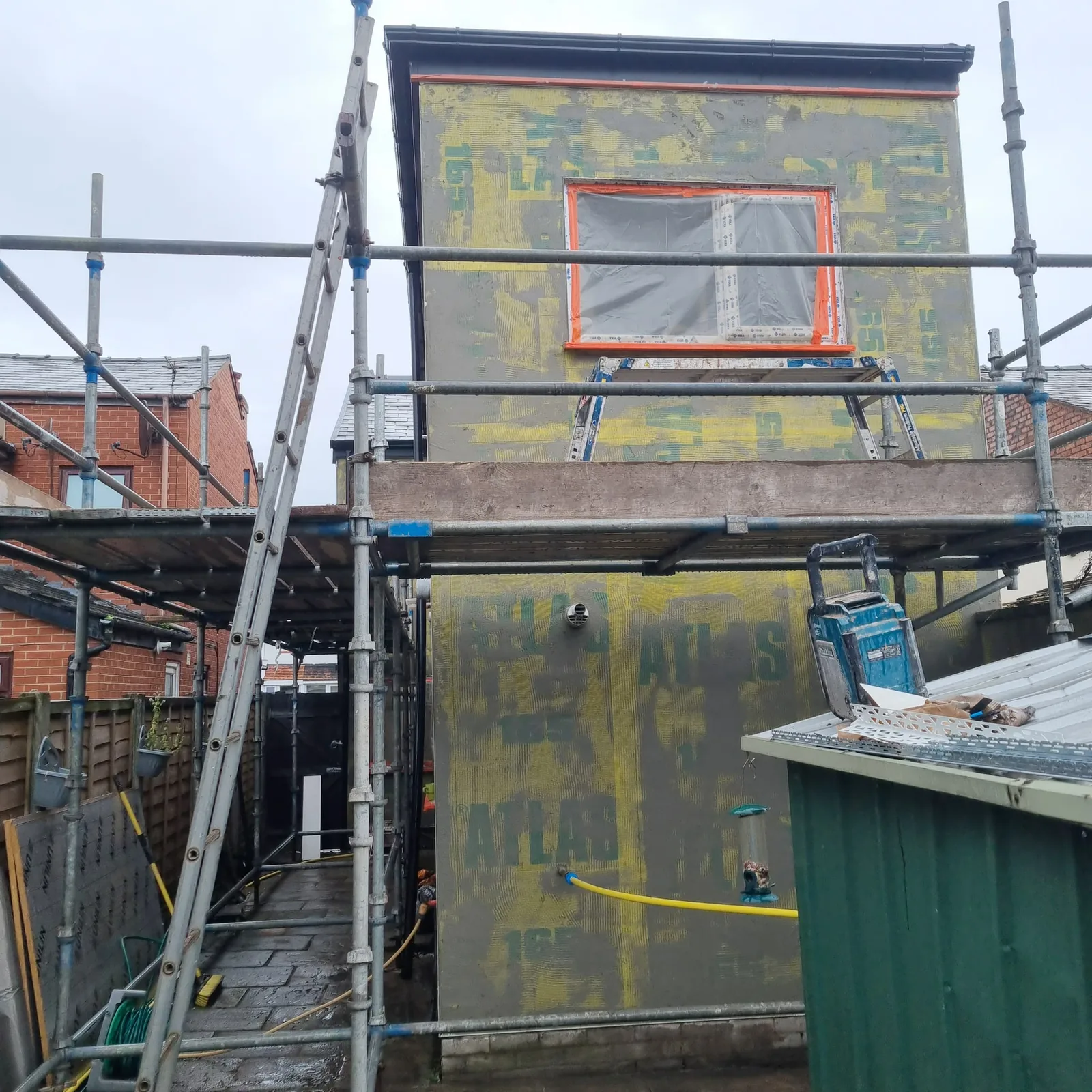 Atlas insulation boards with basecoat over on a two-storey rear outrigger, Southport