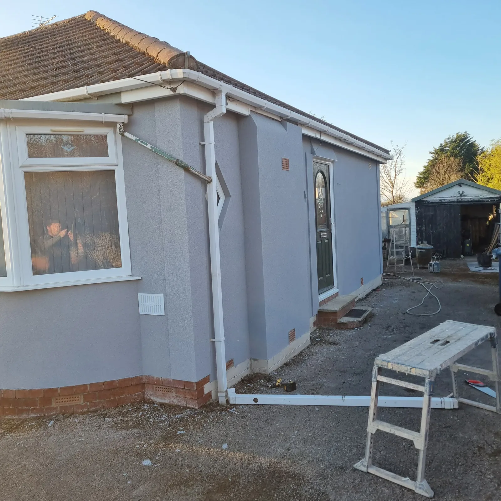The same Maghull bungalow finished in grey silicone render