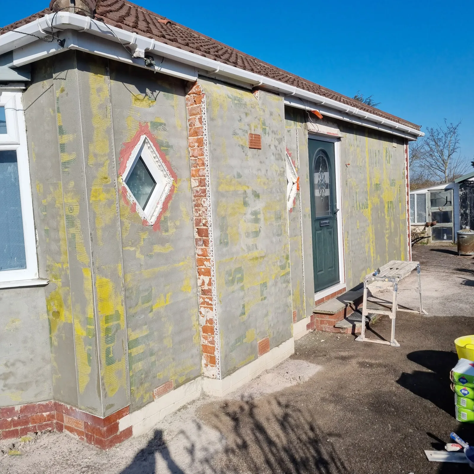 Bungalow in Maghull with the old painted finish stripped back before rendering