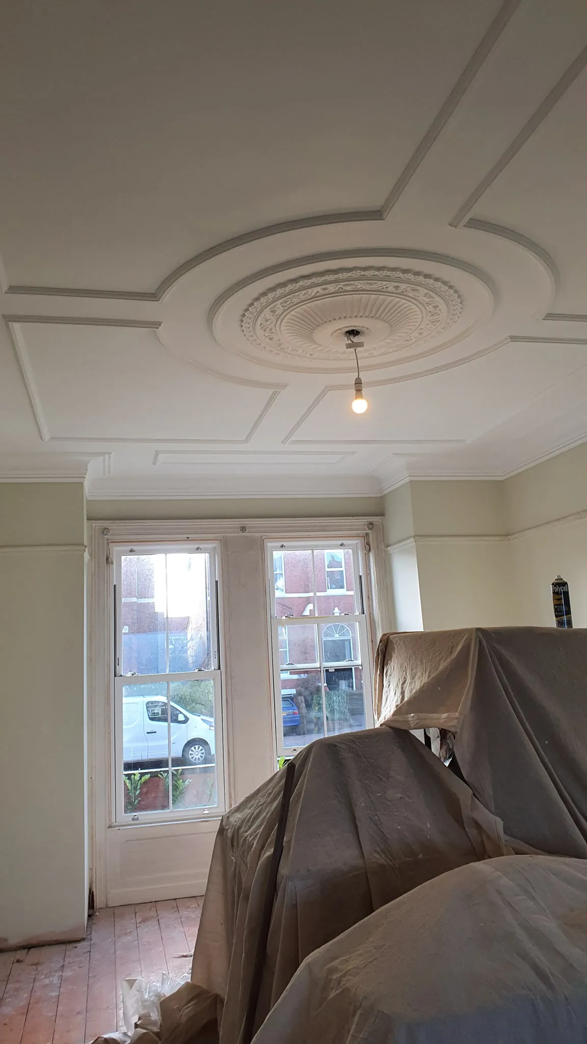 Decorative ceiling above bay sash windows in a period Southport room