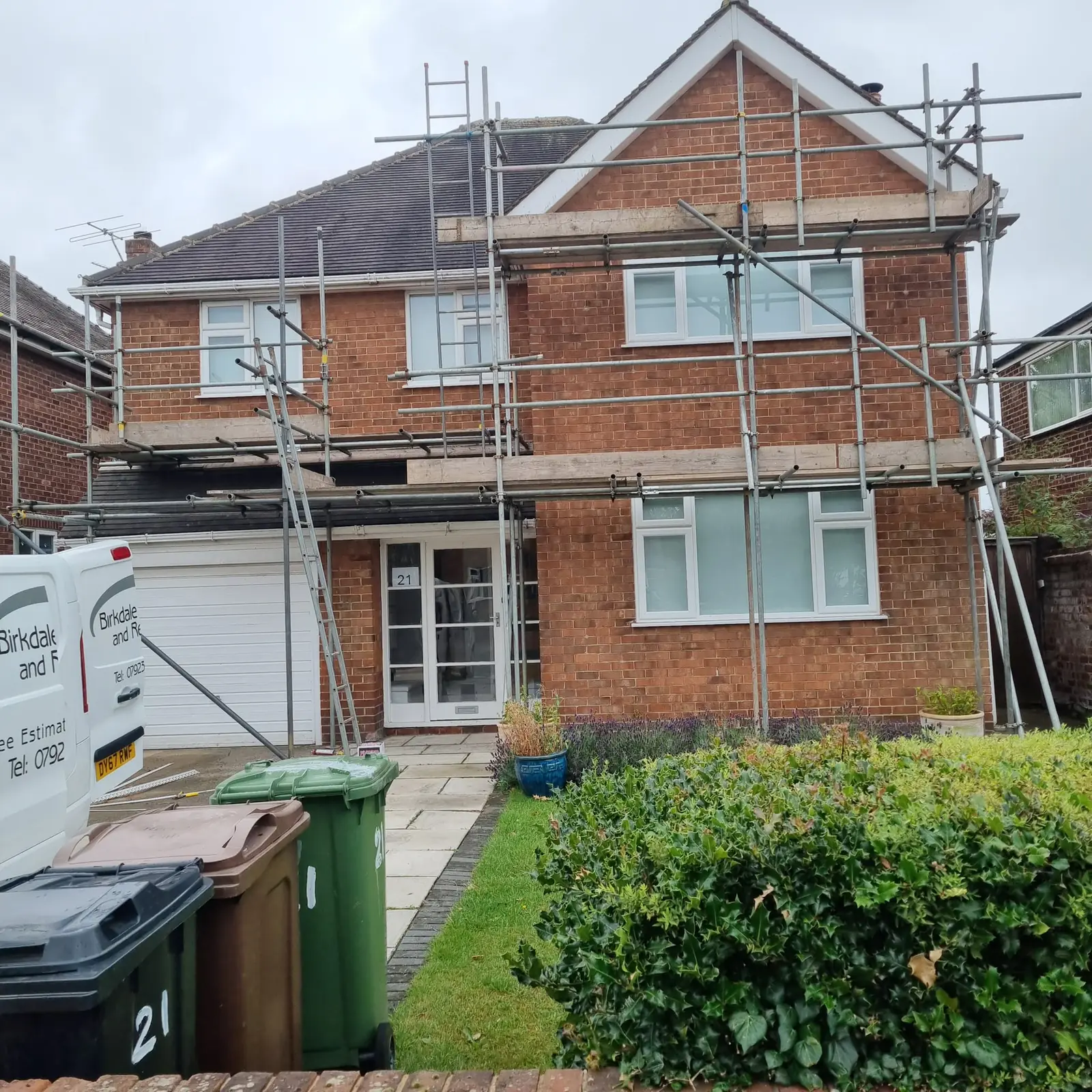 Detached house in Birkdale in bare red brick with the scaffold up before rendering