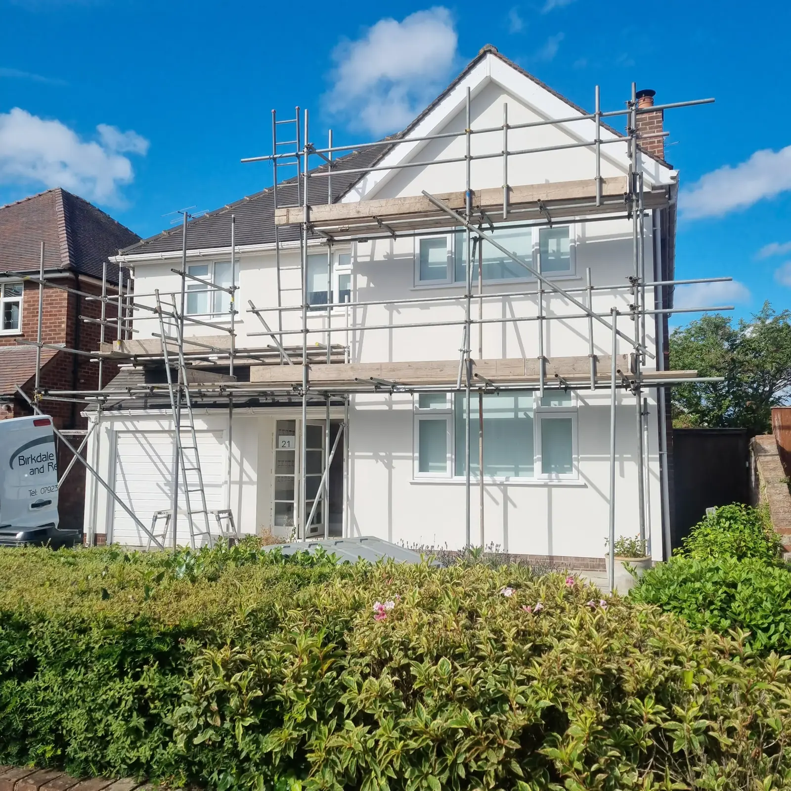 Detached house in Birkdale finished in white render with the scaffold still up
