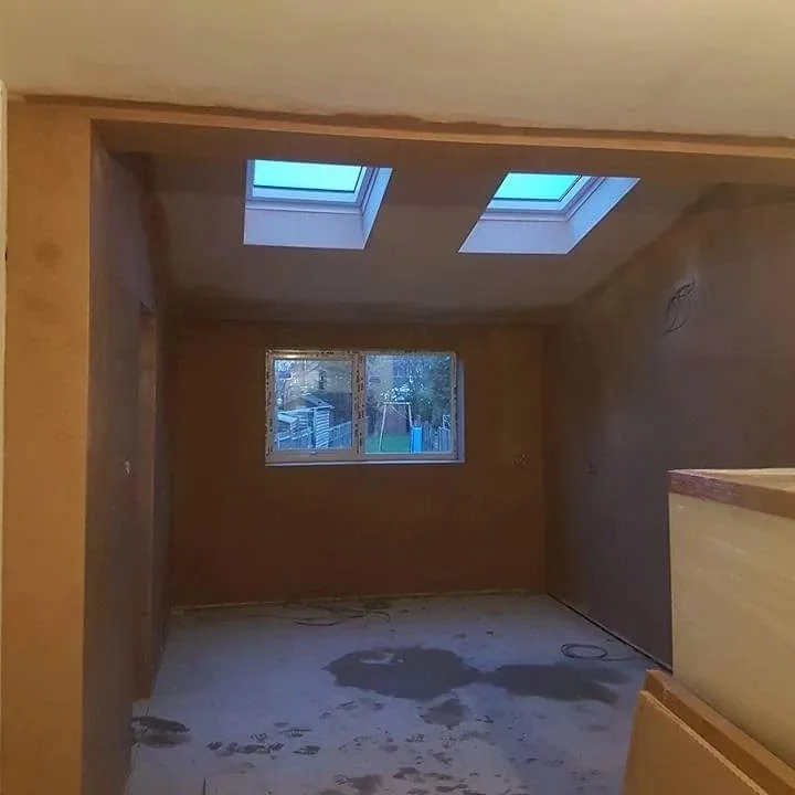 Loft room skimmed with two Velux roof windows and a gable window, Southport