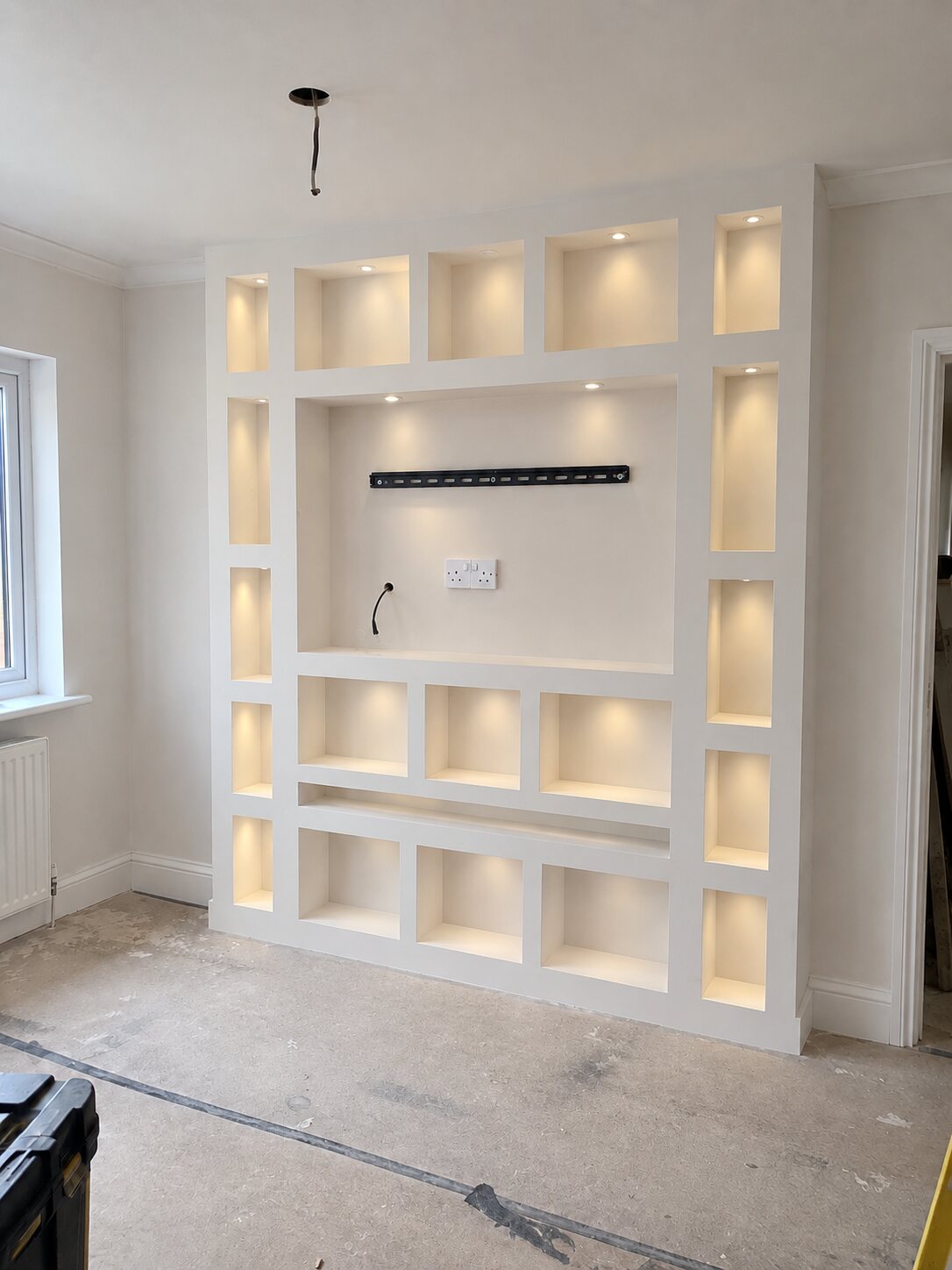 Media wall in Southport after, skimmed and finished with a downlight in every alcove