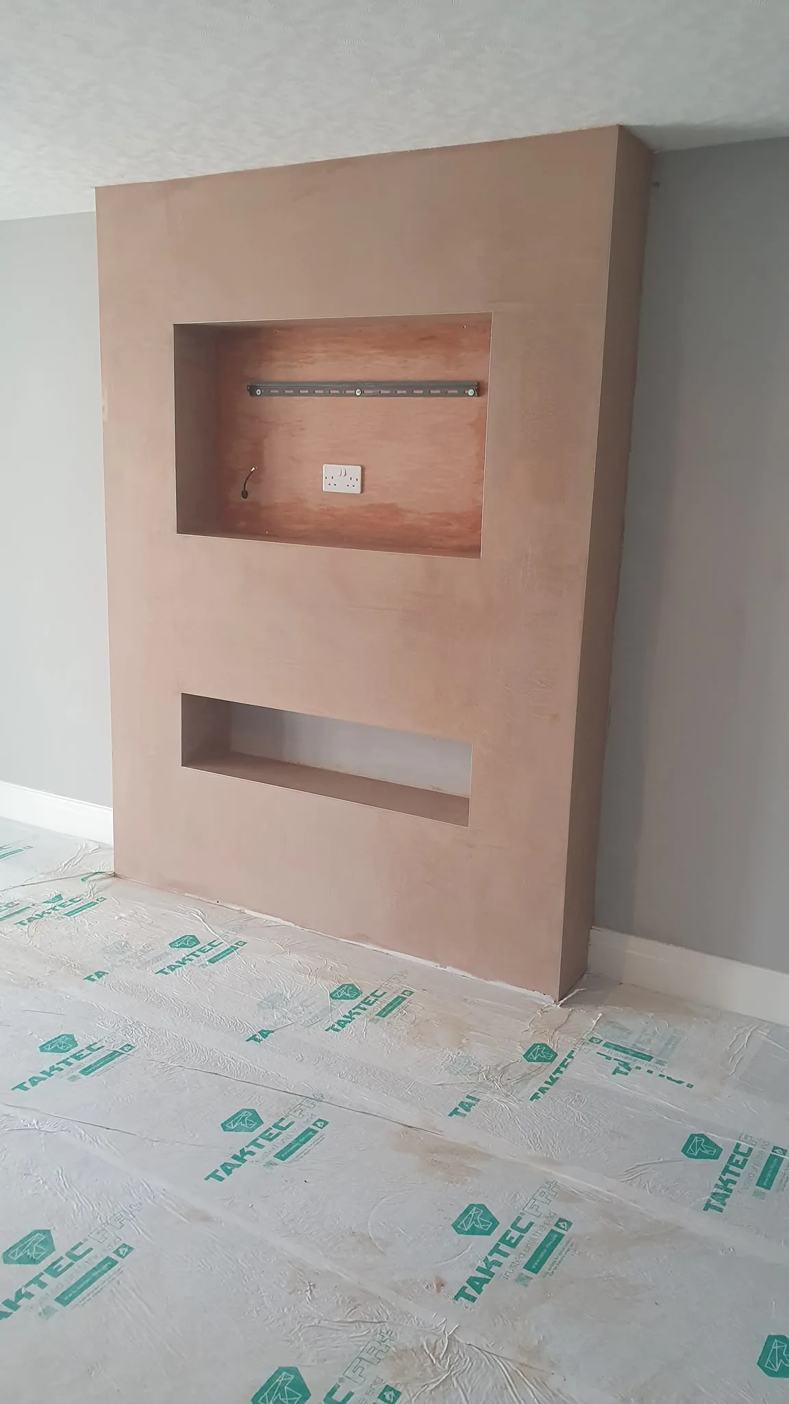 Bespoke media wall from an angle showing the plastered recess returns, Southport