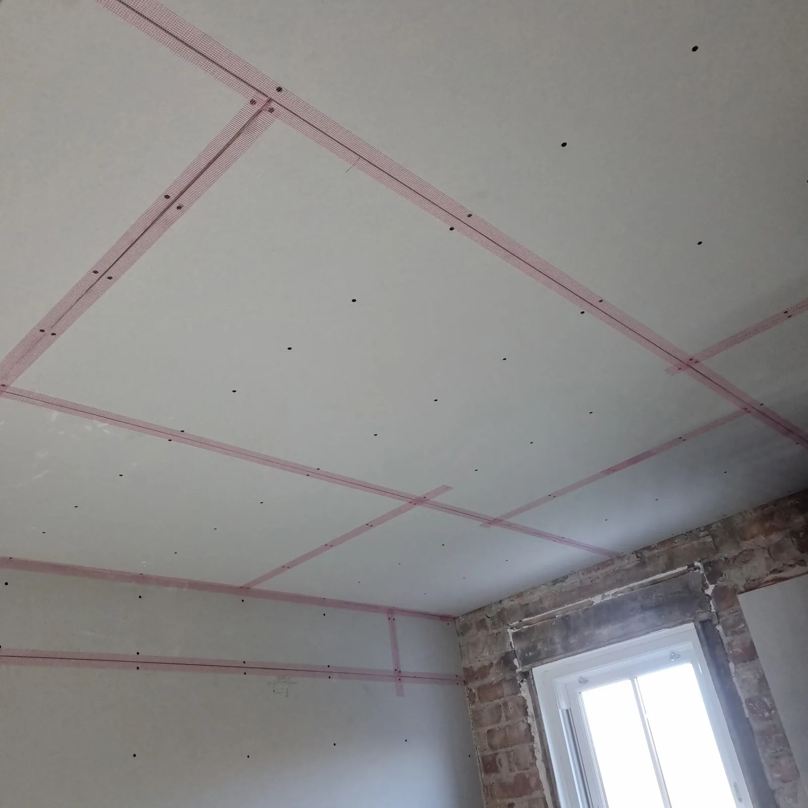 Plasterboarded ceiling with scrim-taped joints ready to skim, Southport
