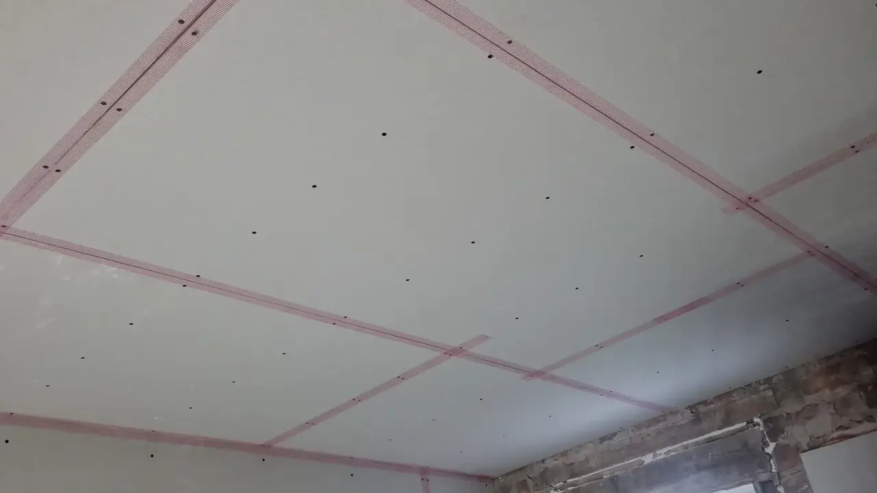 Ceiling overboarded and scrim-taped ready to skim in Southport, which is how an artex ceiling is usually covered