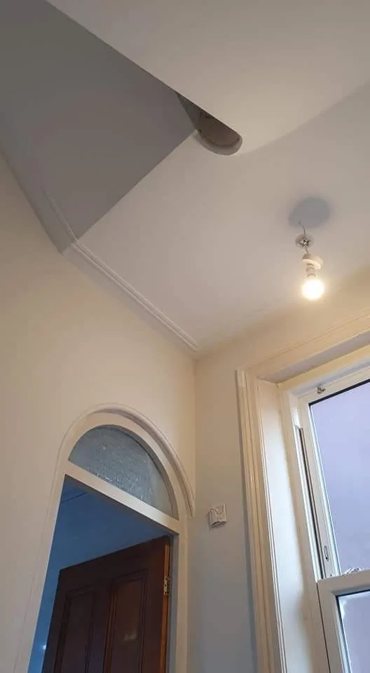 Finished plastered hallway with cornice and arched glazed door, Southport