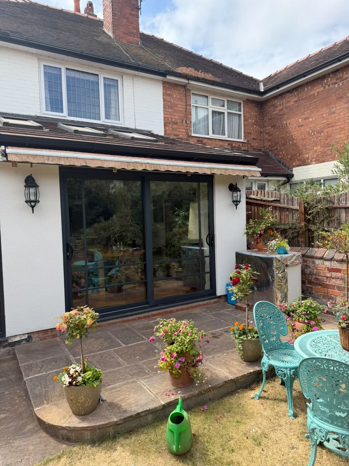 Rear elevation in white render with sliding doors onto a patio, Southport