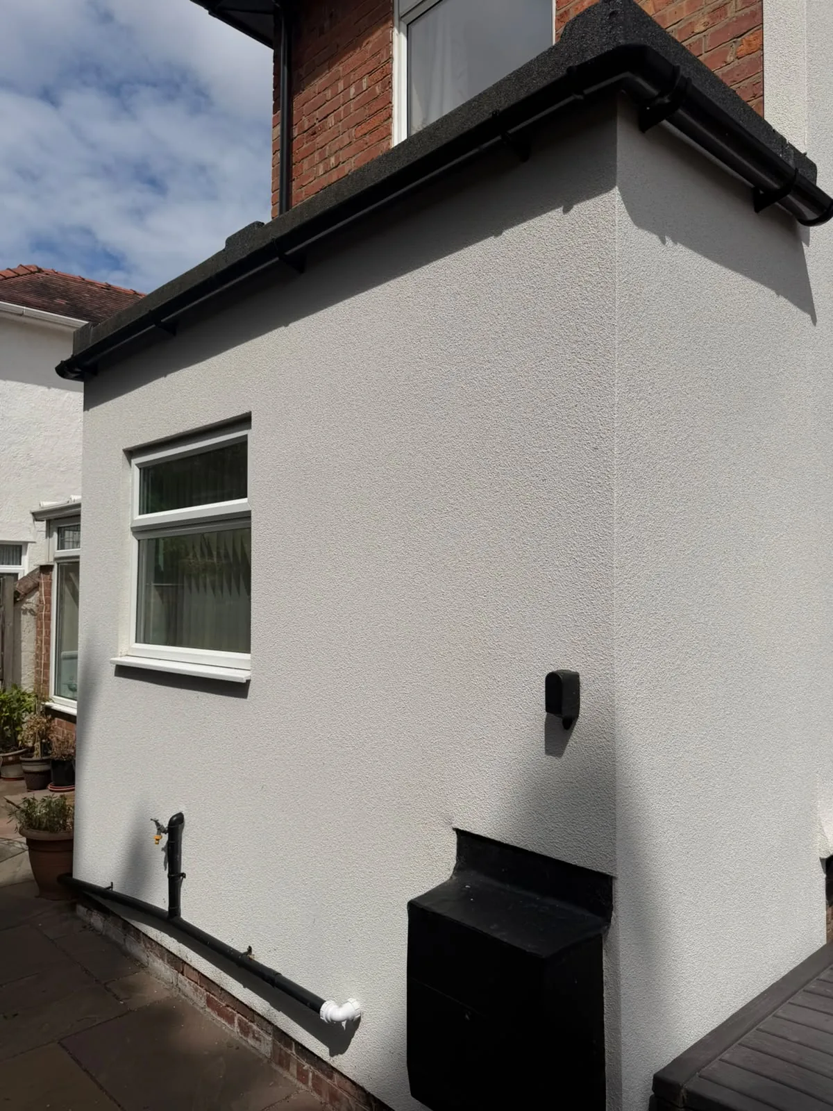 Small rear outrigger finished in crisp white render, Southport