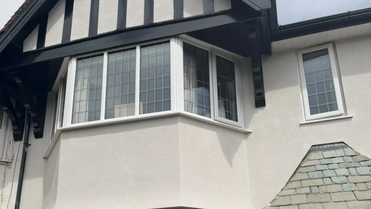 Cream rendered semi with twin bay windows