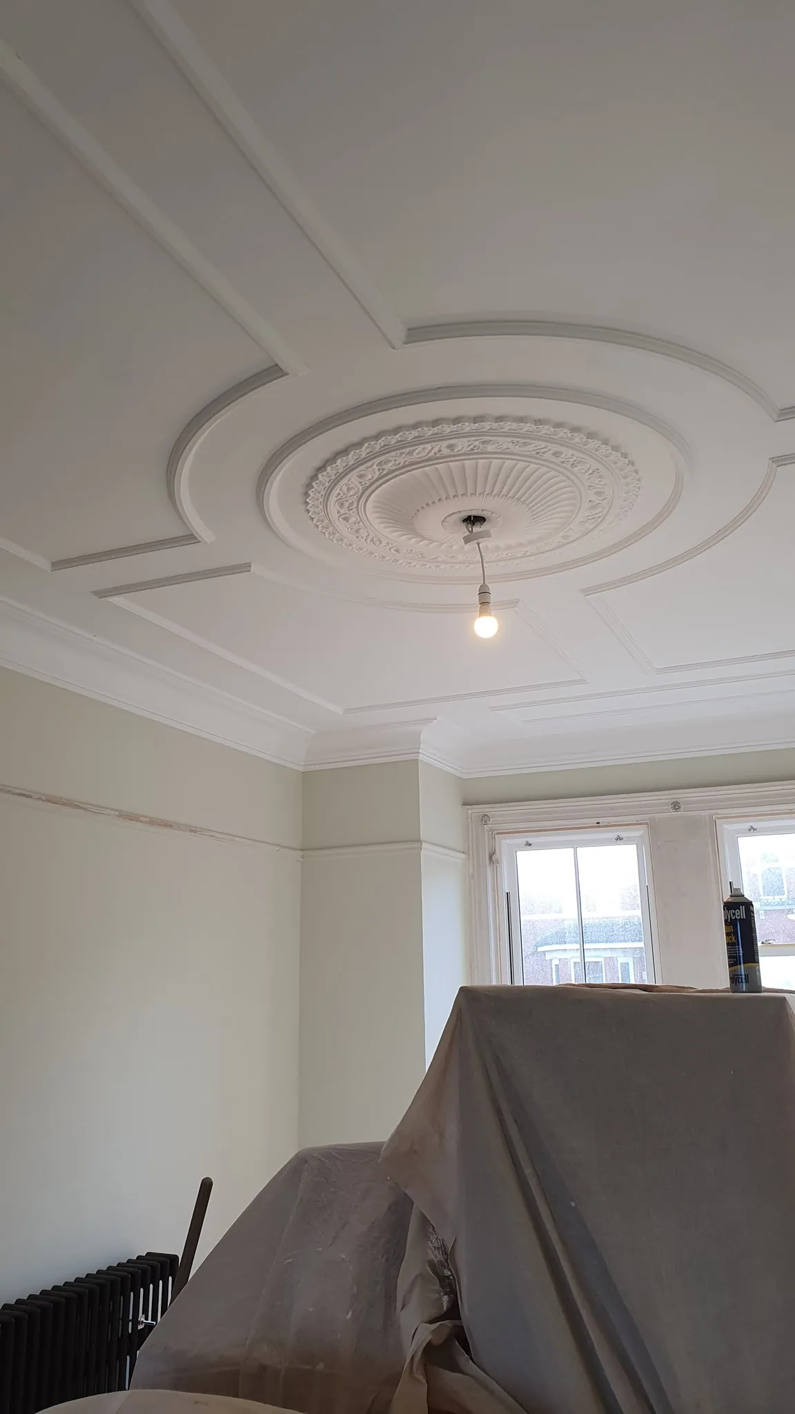 Restored ornate ceiling with rose and circular banding finished in white, Southport