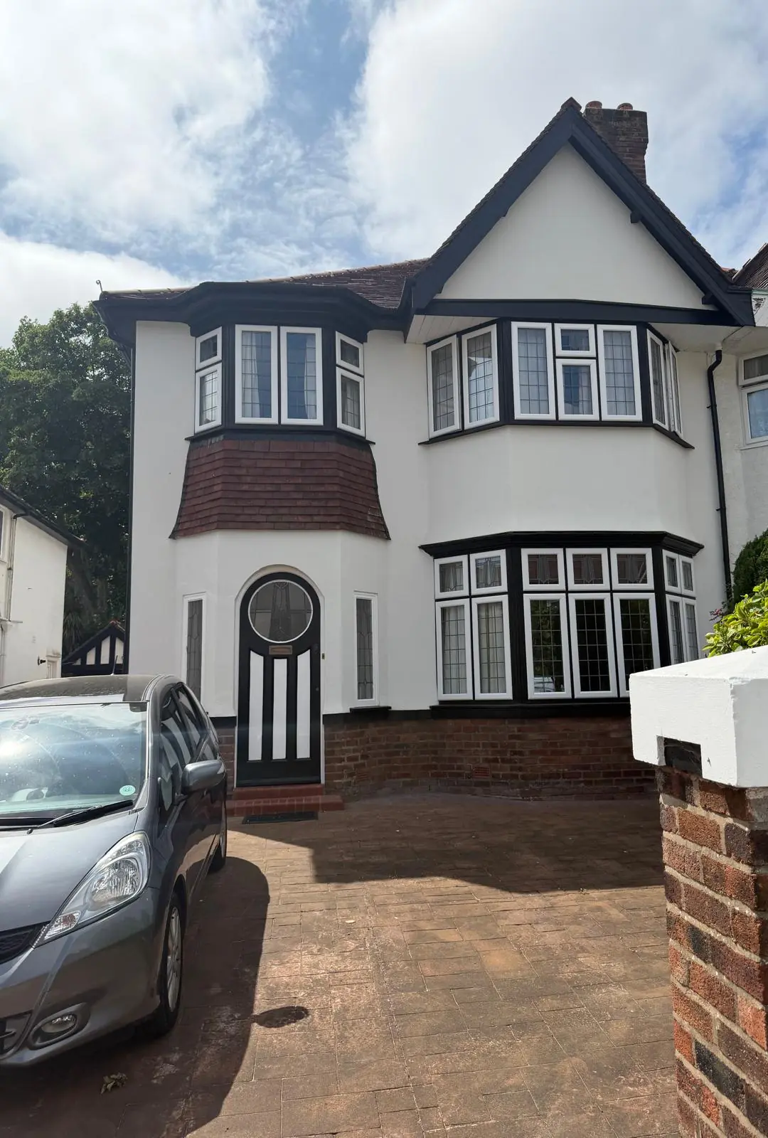 Silicone render finished across the full front elevation of a 1930s semi in Southport