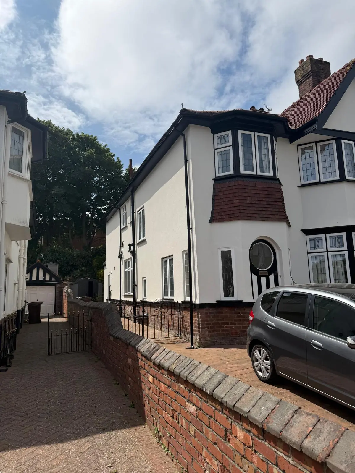External rendering finished across the front and side elevation of a Southport semi, seen from the street