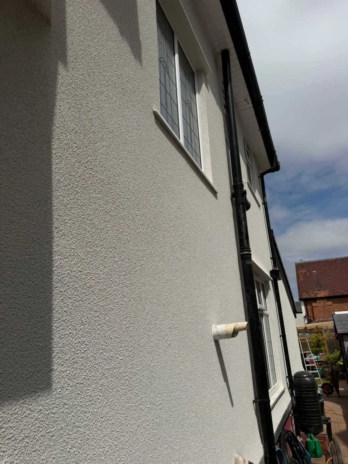Close-up of finished silicone render texture on a gable end in Southport