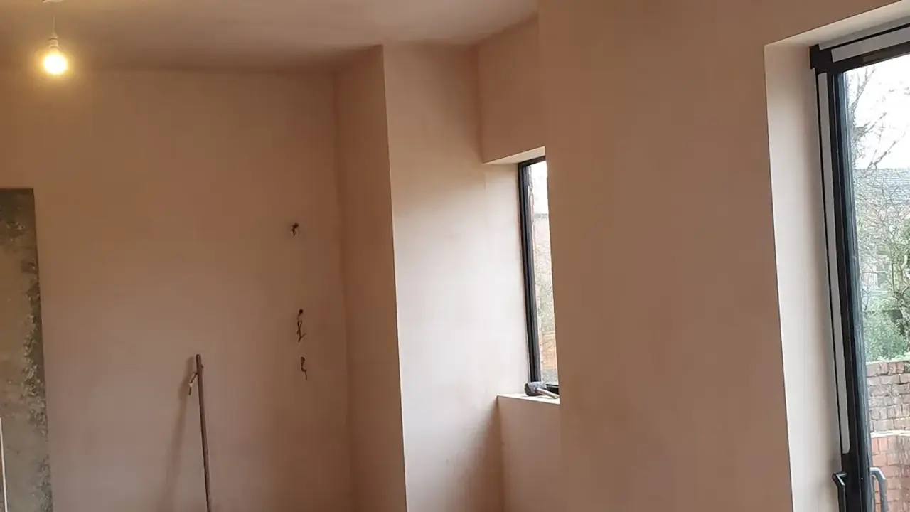 Freshly skimmed open-plan room with boxed beam and bi-fold doors, Southport