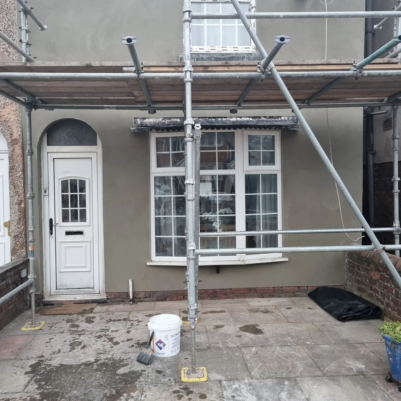 Terrace in Churchtown in its old grey painted render before the strip back